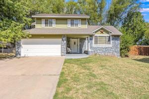 a house with a driveway in front of it at The KANtucky Derby Home in Derby +18 photos