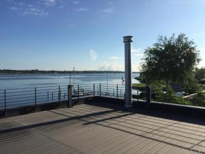 a boardwalk with a view of the water at Fjordhaus Schleiwind in Fahrdorf