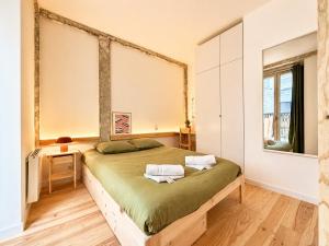 a bedroom with a bed and a large window at " L'Atelier Signature " Piscine - Terrasse - Wifi in Toulouse