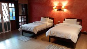 Postel nebo postele na pokoji v ubytování Sala Done Khone Hotel