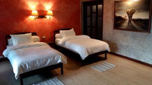 Postel nebo postele na pokoji v ubytování Sala Done Khone Hotel