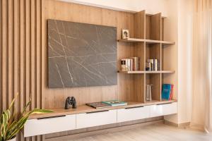 a classroom with a chalkboard on a wall at Riviera Zen apartment in Mesochórion