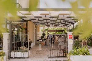 an entrance to a building with a gate and plants at Luxury rooms il Ponte Trogir II in Trogir
