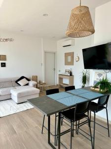 a living room with a table and a couch at Paradise Lake View in Castro