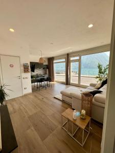 a living room with a couch and a table at Paradise Lake View in Castro