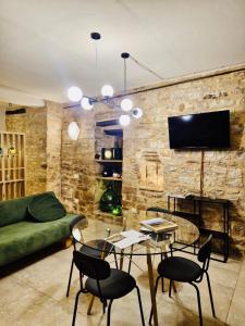 a living room with a stone wall at Loft in Love in Spello