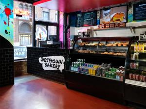 a fast food restaurant with a counter with food and drinks at ACME Hotel Chicago, Outset Collection by Hilton in Chicago +5 photos
