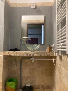 a bathroom with a sink and a mirror at Moulin de Bapaumes in Nérac +99 photos
