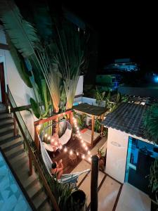 an overhead view of a patio at night with lights at Pousada Praiana in Porto De Galinhas
