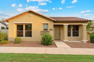 a yellow house with at Getaway at Power Ranch in Gilbert