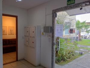 an open door to a room with a living room at Apt Térreo in Resende
