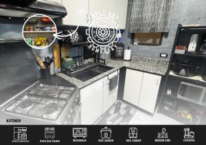 a kitchen with a sink and a stove in it at Vault 607 Homestay in Davao City