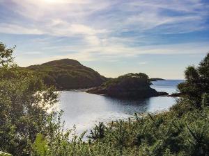 a view of a body of water with a mountain at Seafield House in Lochinver +29 photos