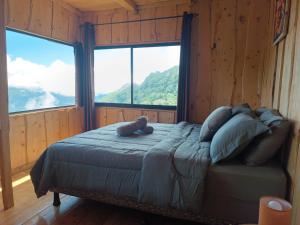 a bedroom with a bed with a teddy bear on it at Calcopirita Stay House in Rivas