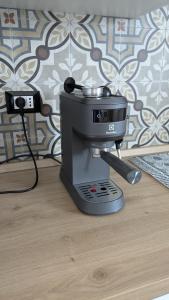 a mixer sitting on top of a wooden floor at AURA MARINA - Guest House Fiumicino in Fiumicino