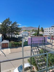 a view of a city with a parking lot at Espacio Pueyrredón in Comodoro Rivadavia