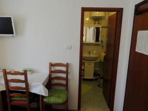TV a/nebo společenská místnost v ubytování Rooms Stefania