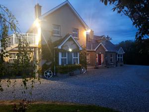 a house with a cross on the front of it at The Free Range Room at The Cracked Hen in Gorey