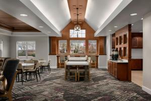 a kitchen and dining room with a table and chairs at Residence Inn Boise West in Boise