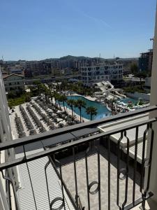 a balcony with a view of a marina at Dengu Luxury Apartments in Golem