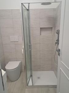 a bathroom with a shower and a toilet at Brezza d'amare a lovely accommodation in Anzio in Anzio +30 photos