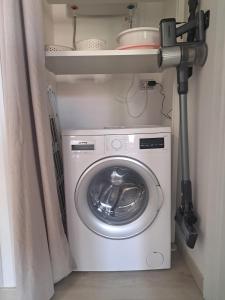 a washer and dryer in a small room at Brezza d'amare a lovely accommodation in Anzio in Anzio