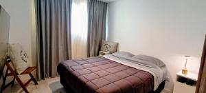 a hotel room with a bed and a window at Tigre a estrenar in Tigre +10 photos