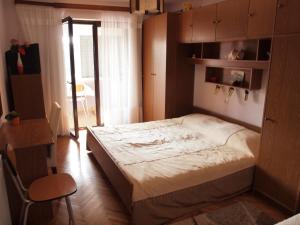 a bedroom with a large bed in a room at Apartments Žufić in Štinjan