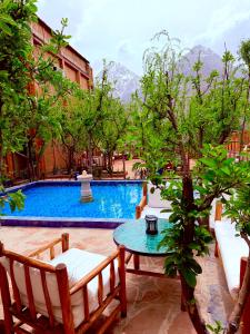 a patio with a table and chairs and a pool at Afla views in Imlil +41 photos