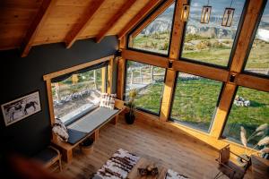 an overhead view of a living room with large windows at Mountain Dream Chalet Durmitor in Nedajno