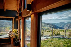 a room with a window with a view of the mountains at Mountain Dream Chalet Durmitor in Nedajno +39 photos