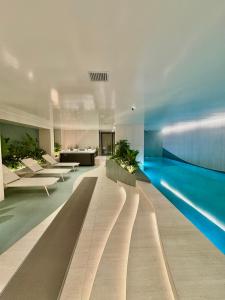 a large swimming pool in a building with a swimming pool at Cielo Apartments with top amenities in Quito