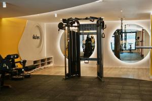 a room with a gym with a mirror at Cielo Apartments with top amenities in Quito