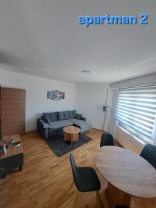 a living room with a couch and a table at Apartman Vranje in Vranje