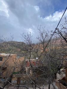 a view of a city from behind a tree at imlil in Imlil