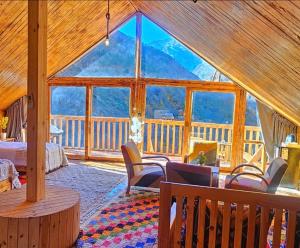 a room with a large window in a cabin at Afla views in Imlil
