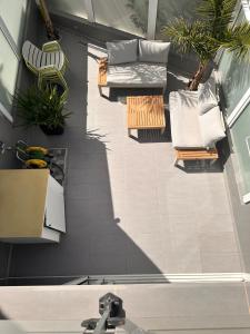 an overhead view of a living room with chairs and tables at Casa De Pablo - Marbella Golf in Maspalomas