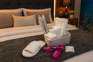 a hotel room with a bed with a bunch of towels at 77 Lisbon Design Apartment near Airport, Lisbon, Amadora, Odivelas & Sintra in Caneças
