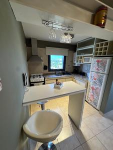 a kitchen with a white counter and a sink at Mono Ambiente Con Vista Panorámica Zona Sur in Santiago del Estero