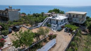 an aerial view of a house with the ocean behind it at Vida House in Borsh