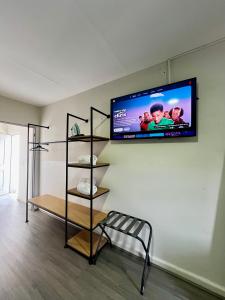 a flat screen tv hanging on a wall at Jazz & Stay in Guadalajara