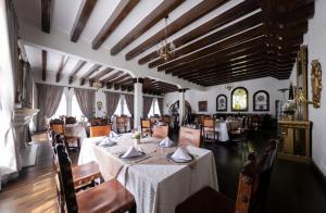a dining room with a table and chairs in it at Hotel Royal Spa in Zimapán