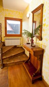 a living room with a wooden floor and a large window at U Gabryla in Biały Dunajec