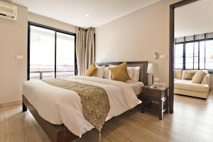 A bed or beds in a room at Citismart Luxury Apartments