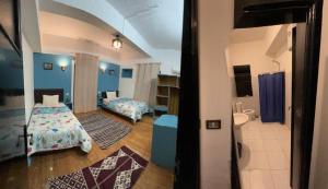 a room with a bedroom with a bed and a bathroom at happy life hostel in Cairo