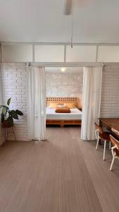 a large room with a bed and a table at CASA LOOL BEH in San Miguel de Allende +31 photos