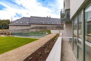 a courtyard of a house with a garden at Apex Executive Apartments - The Lookout in Dublin +30 photos