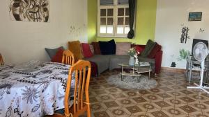a living room with a couch and a table at La maison de la plage in Sainte-Luce +10 photos