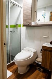 a bathroom with a toilet and a glass shower at HotelSueño Dorado Aguadas in Aguadas +19 photos