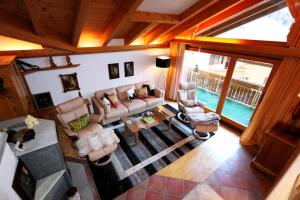 an overhead view of a living room with a pool at Dominic A in Saas-Fee